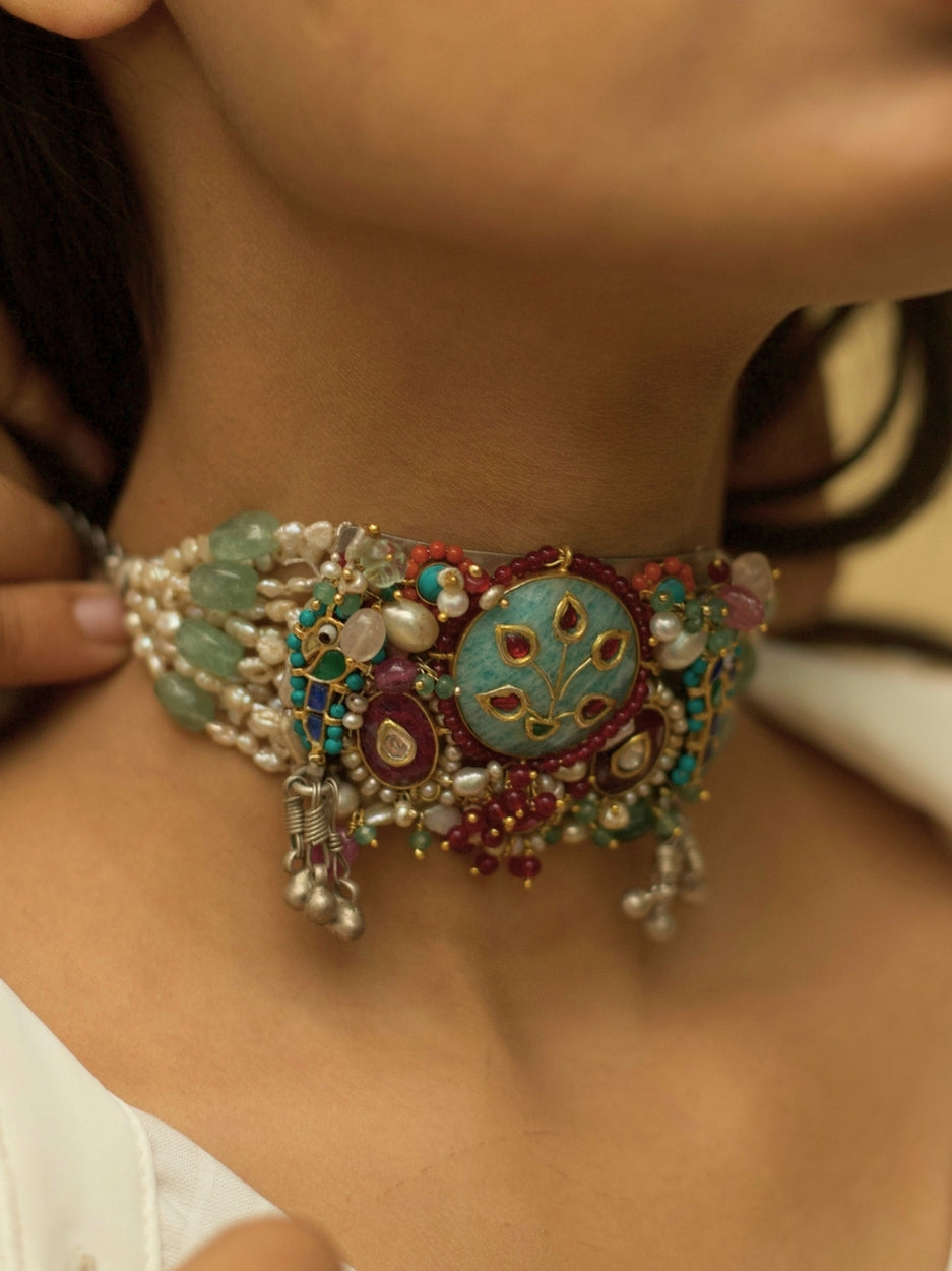 Exquisite pearl and kundan bracelet in pure 925 silver with sea-green, teal, blue, and red stones by Naksa.