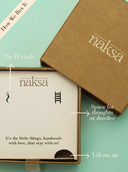 Game On Studs by Naksa—mismatched 92.5 silver earrings featuring snake and ladder motifs, handcrafted for playful, nostalgic gifting.