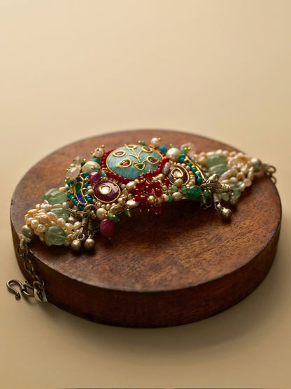 Exquisite pearl and kundan bracelet in pure 925 silver with sea-green, teal, blue, and red stones by Naksa.
