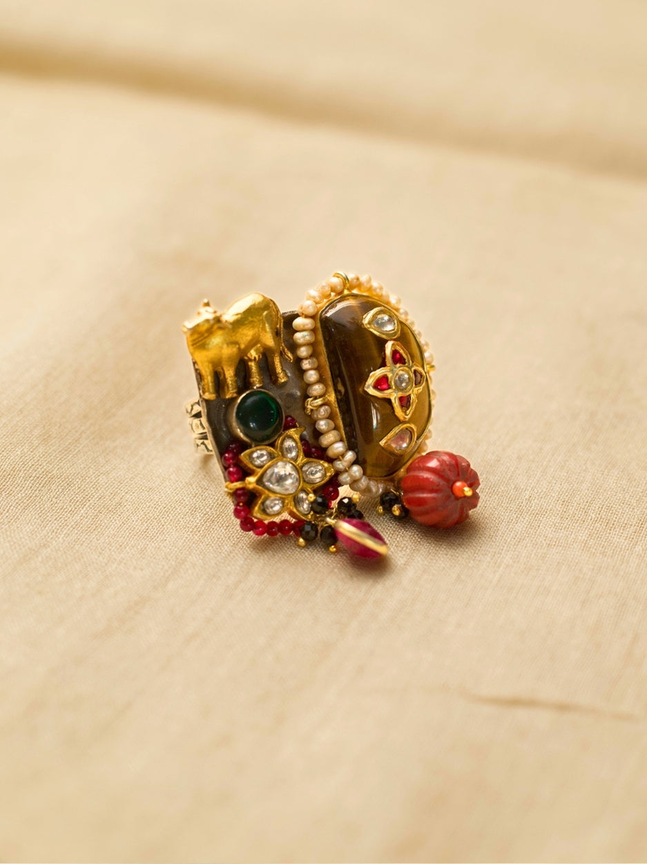 Statement 925 silver ring with elephant motif, tiger’s eye, kundan, and red beads – worn by Ila Arun.
