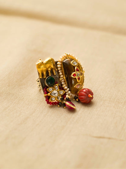 Statement 925 silver ring with elephant motif, tiger’s eye, kundan, and red beads – worn by Ila Arun.