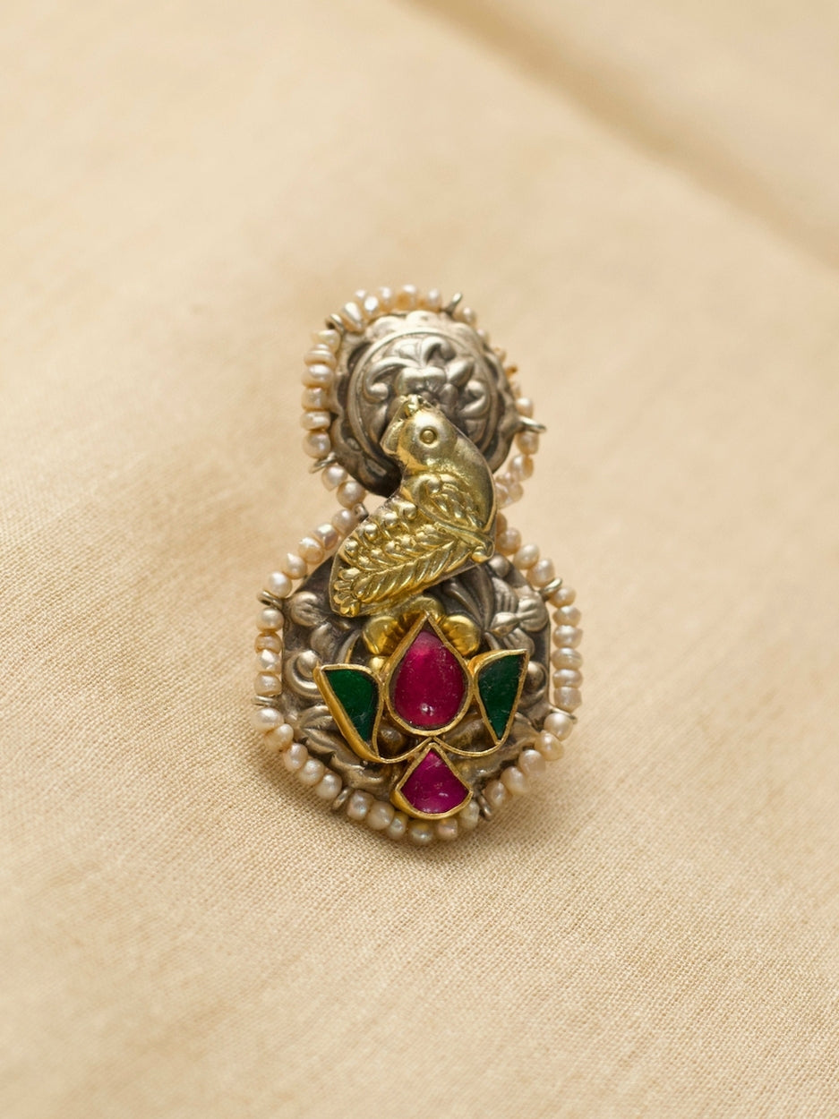 Oxidized 925 silver statement ring with golden dove and lotus motifs, handcrafted by Naksa.