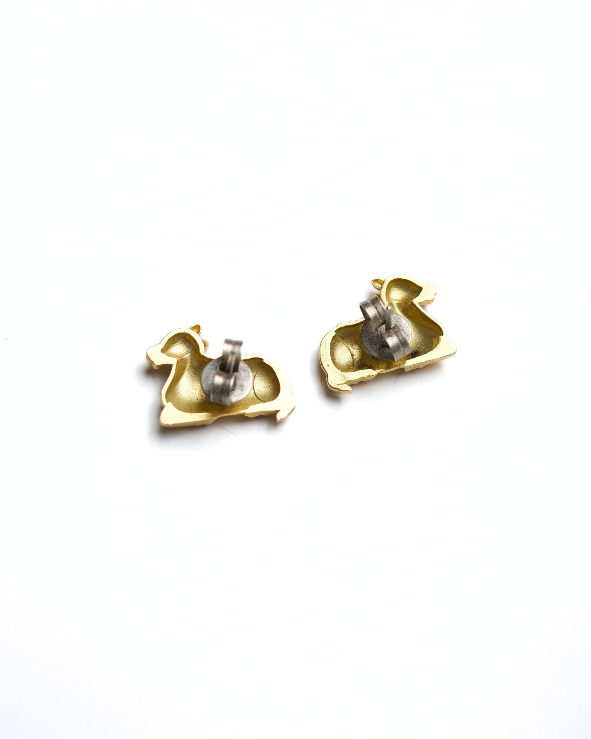 925 silver gold-polished Nandi bull motif stud earrings with detailed carving and temple-inspired design