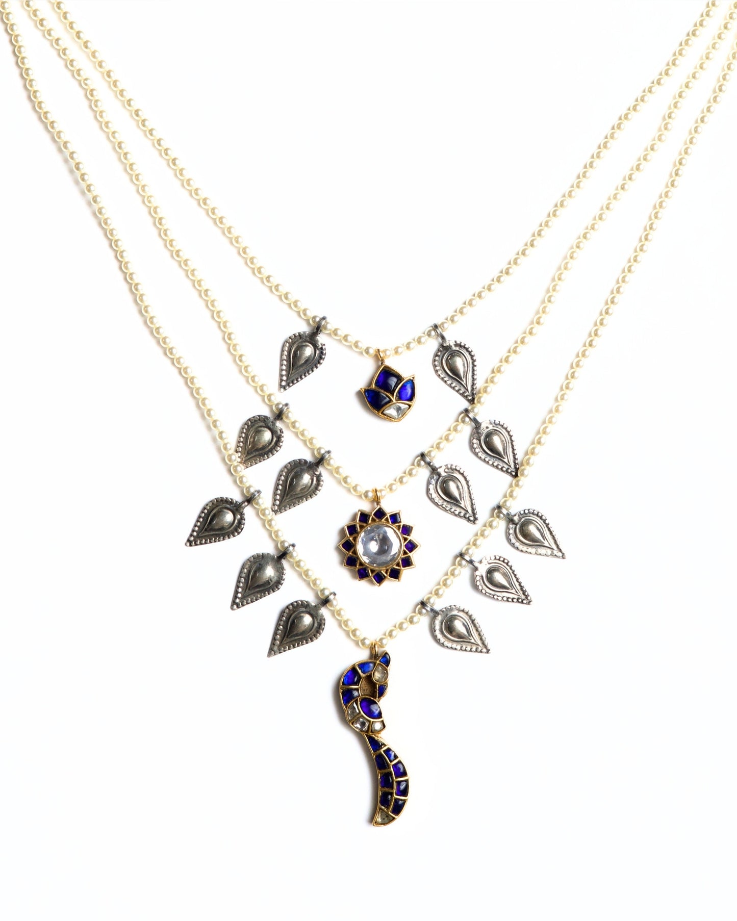 Layered 925 silver gold-polished pearl necklace with silver paisley charms, blue stone lotus pendant and crescent drop centerpiece