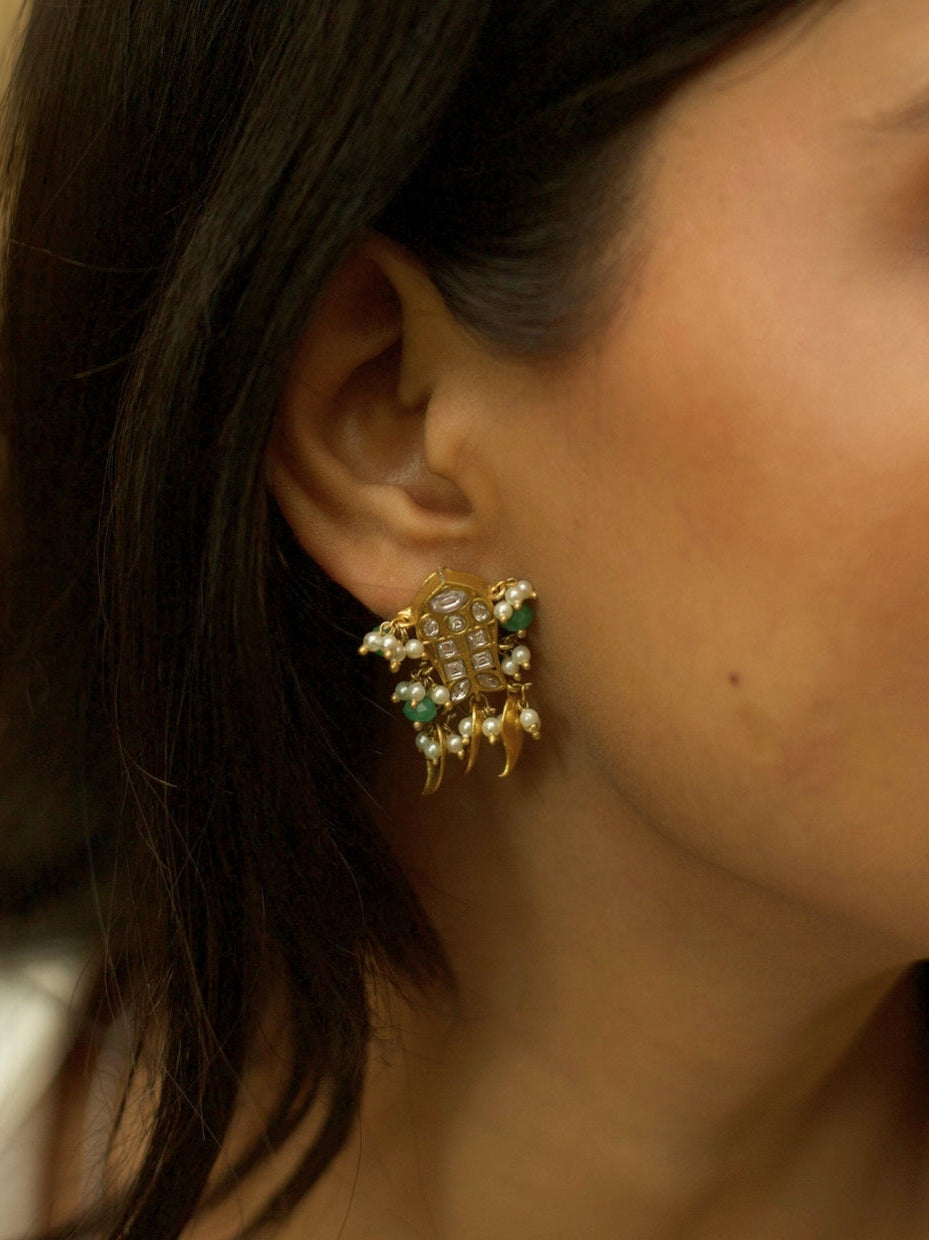 Oxidized 925 silver Hasli necklace set featuring rare carved brown stone, fish charms, pearl drops, and golden leaf earrings by Naksa.