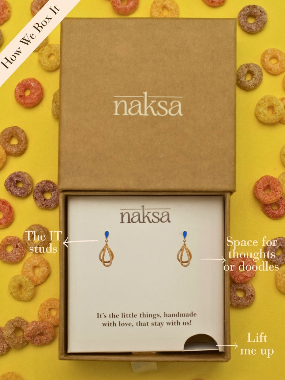 Drop Everything Studs by Naksa—layered raindrop-style 925 silver danglers with matte gold finish and blue enamel top, inspired by monsoon drama.