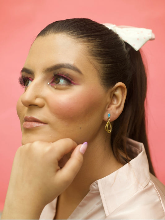 Drop Everything Studs by Naksa—layered raindrop-style 925 silver danglers with matte gold finish and blue enamel top, inspired by monsoon drama.