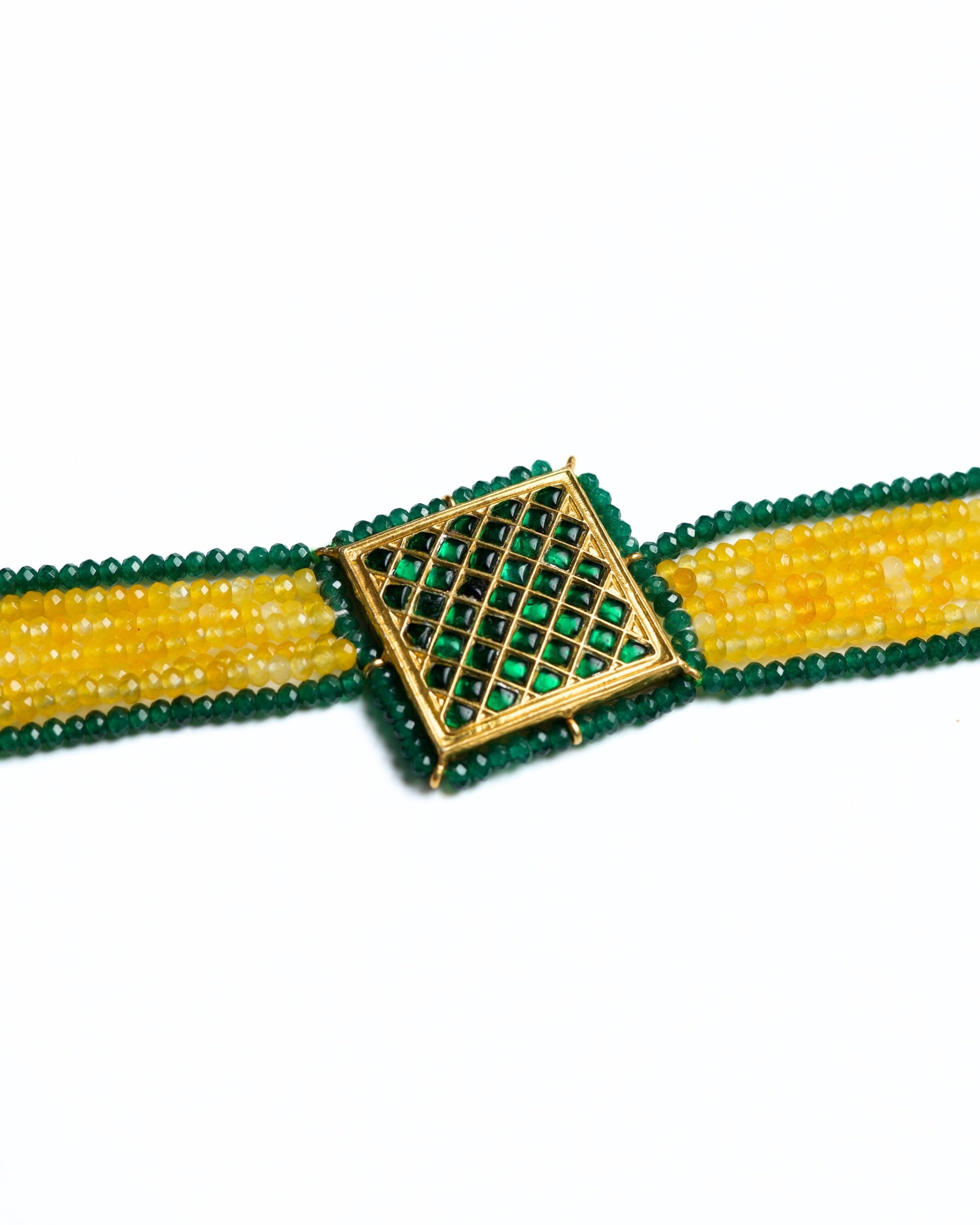 Close-up of a 925 silver gold-polished choker with diagonal yellow and green bead strands and a square lattice centre panel.