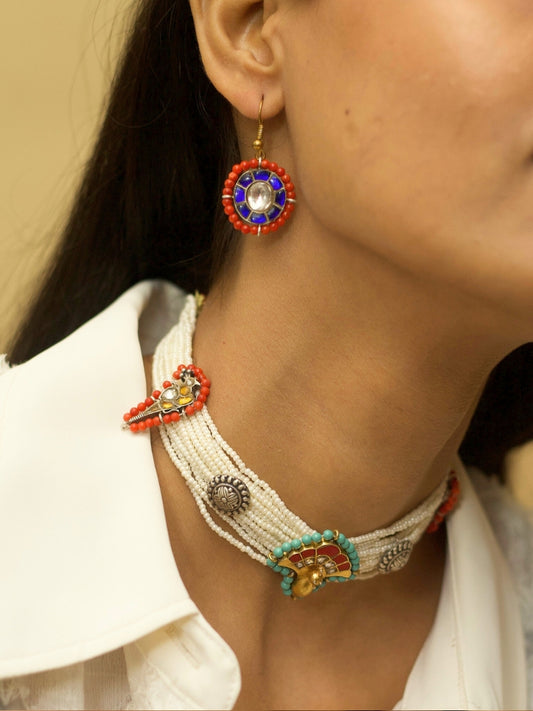 Trendy choker set in pure 925 silver with thick pearl strands, oxidized and two-tone kundan tikras, and mismatched earrings by Naksa.