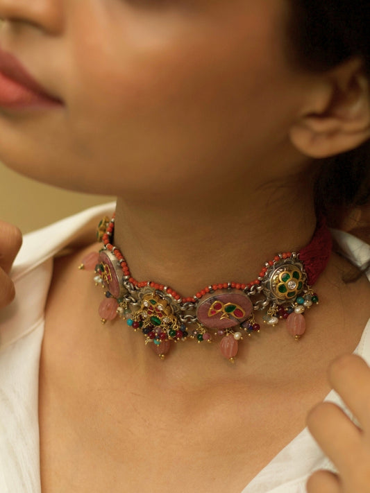 Traditional choker set in pure 925 silver with blush pink stones, kundan parrots and peacocks, and pink pearl drops by Naksa.