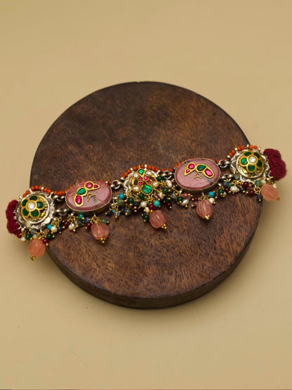 Traditional choker set in pure 925 silver with blush pink stones, kundan parrots and peacocks, and pink pearl drops by Naksa.