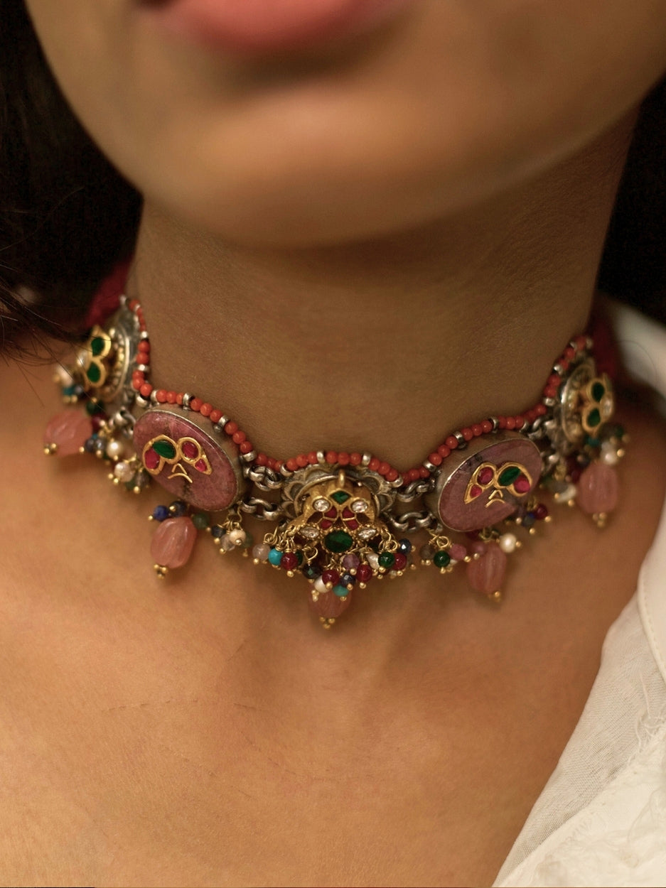 Traditional choker set in pure 925 silver with blush pink stones, kundan parrots and peacocks, and pink pearl drops by Naksa.