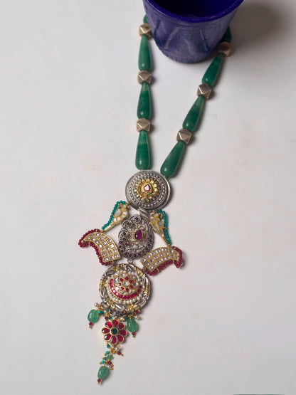 Long handcrafted 92.5 silver necklace with eclectic circular pendants, enamel, moissanite, temple and floral motifs.