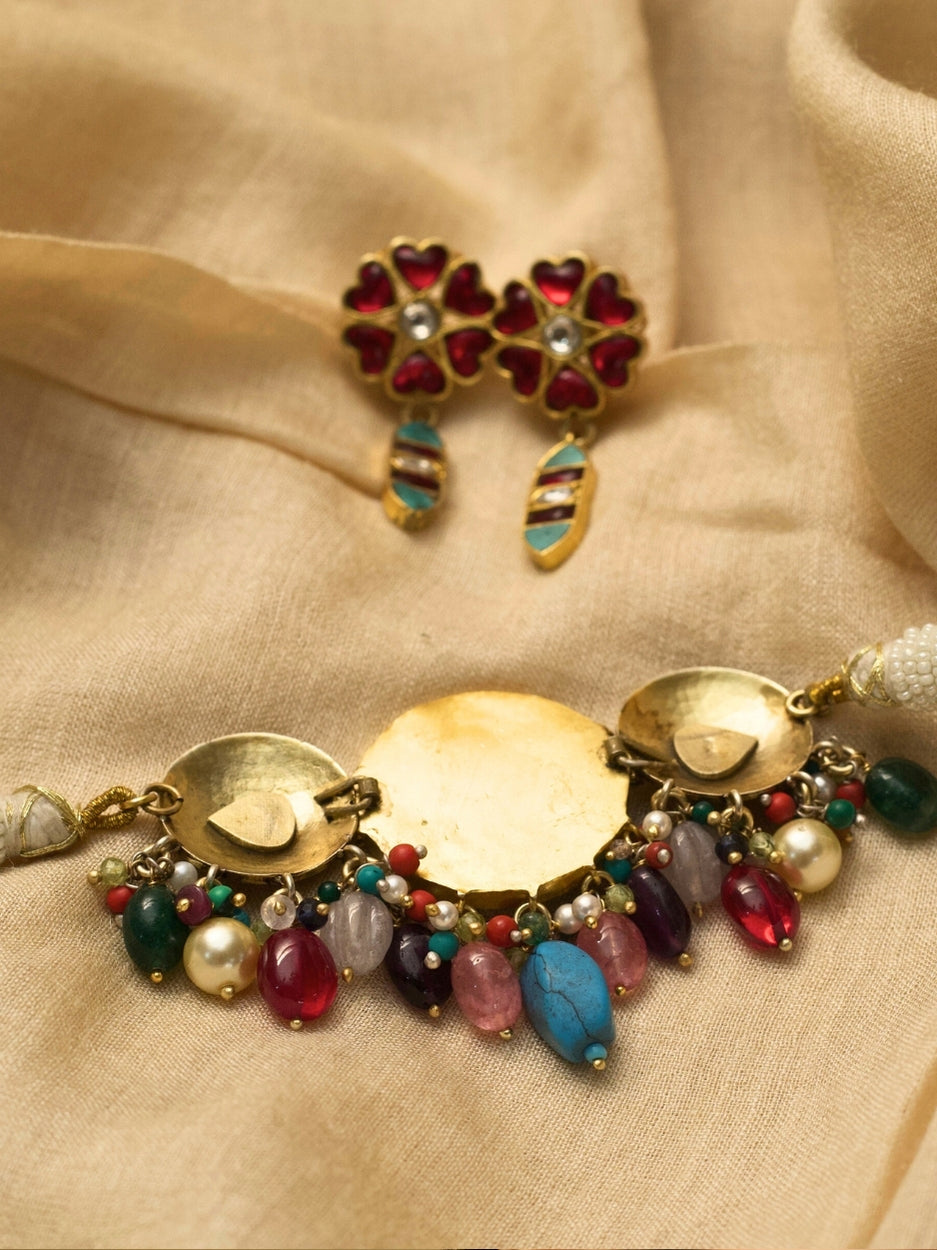 Sweet Defender choker set in pure 925 silver with gold polish, candy-toned stones, and heart-shaped earrings in teal and pink by Naksa.