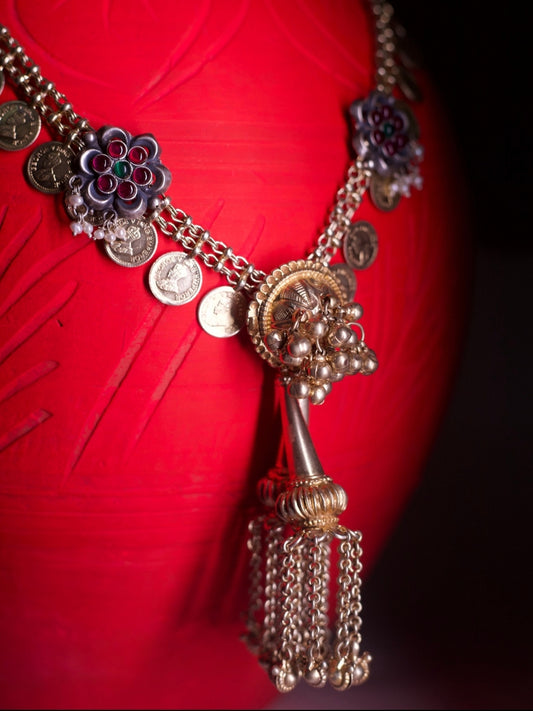 Sikka-inspired gold-silver necklace set with coin chain, floral accents, temple dome pendant, and matching kundan earrings.