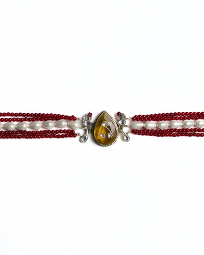 Multi-strand red bead choker in 925 silver with gold polish, pearl accents, and a large honey-toned teardrop stone centre pendant.