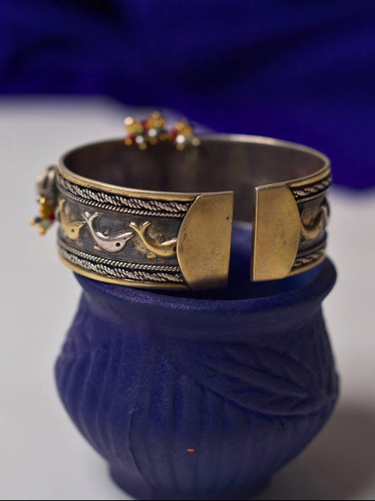 92.5 silver cuff bracelet with floral carving, kundan accents, heritage motifs, and gold-silver dual tone from Naksa’s fusion collection