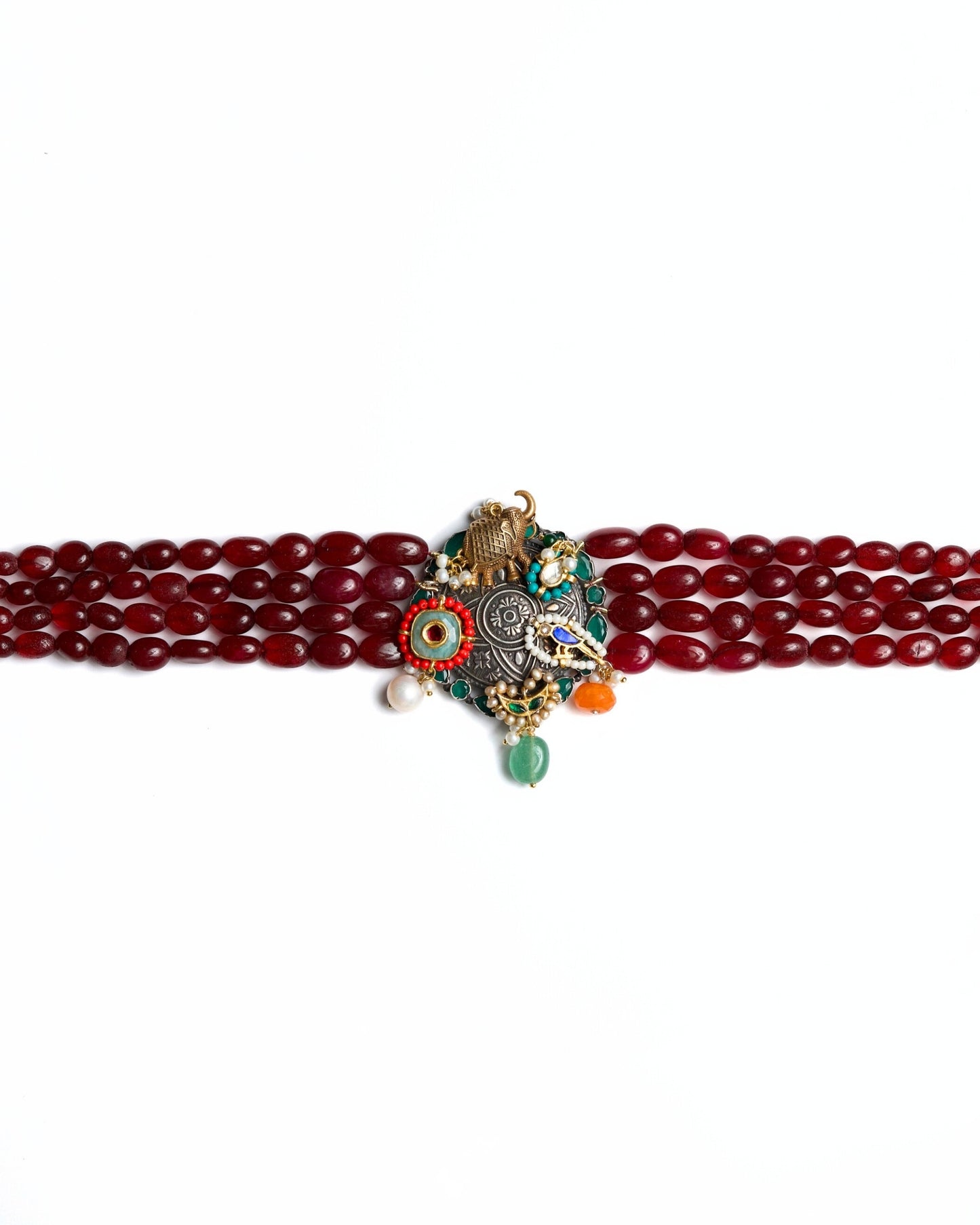 925 silver oxidised statement choker with red oval beads, elephant charm, bird motif, pearl drops, green and orange stone accents, and gold polish detailing.