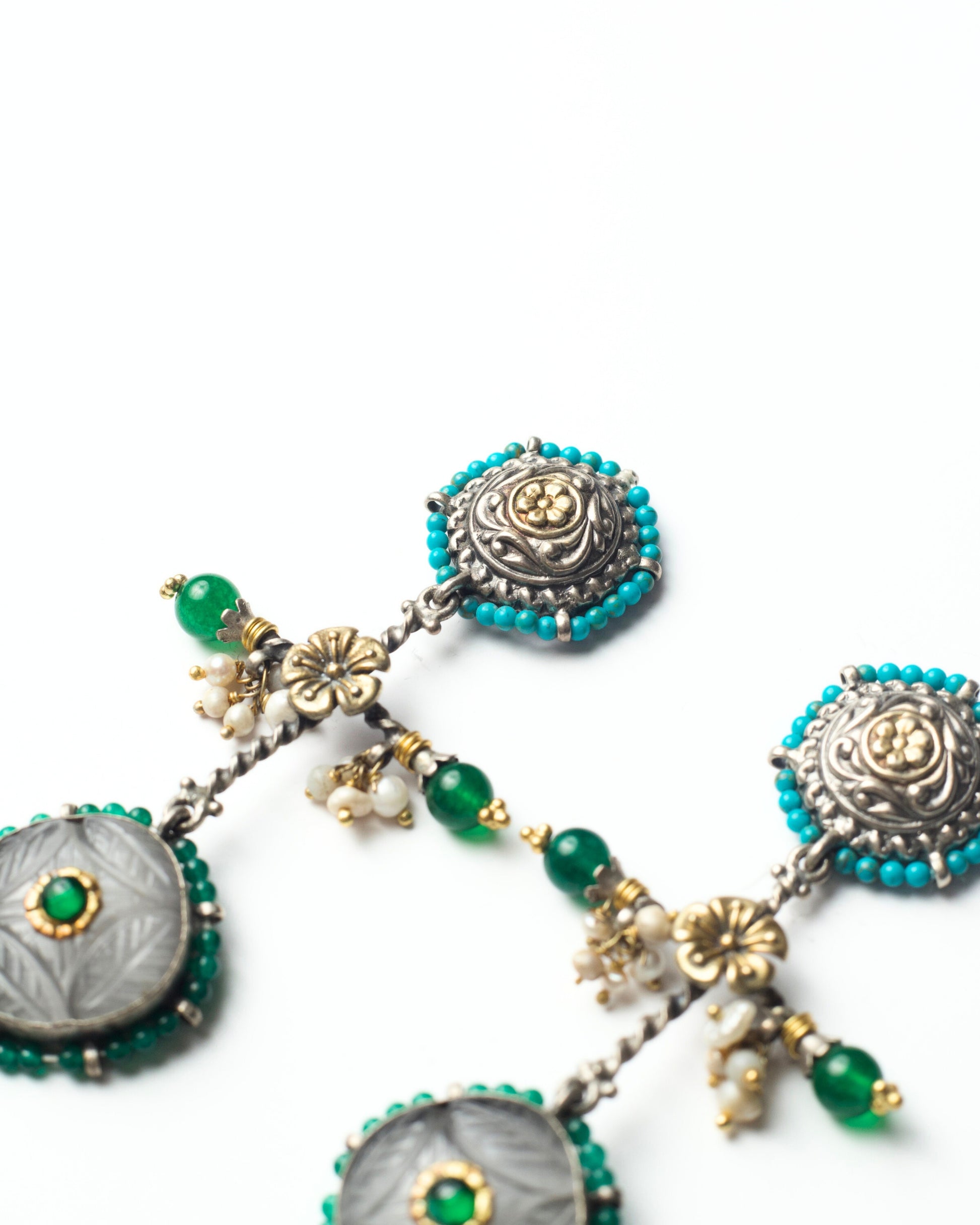 Handcrafted silver fourfold form earrings with beaded detailing