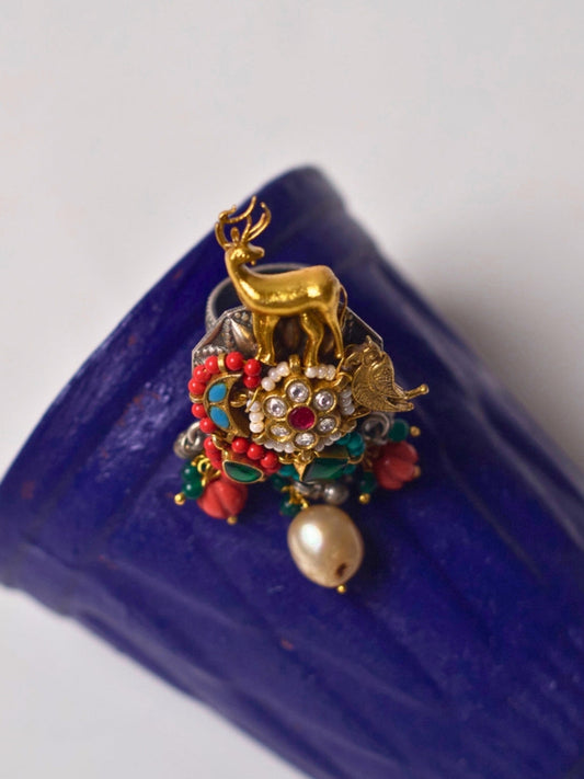 Statement 92.5 silver ring featuring a gold deer motif, gemstone florals, and pearl drop – Naksa fusion jewelry
