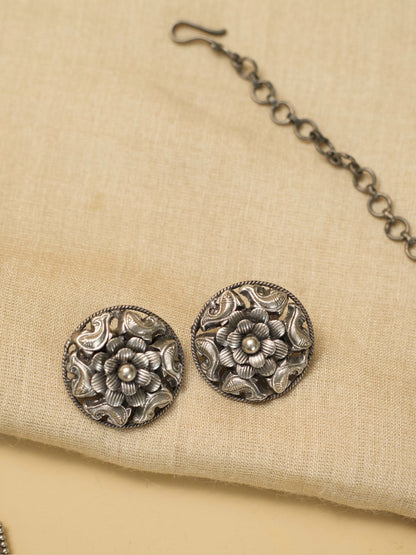 alrupi Haar by Naksa—oxidized 925 silver crescent necklace with fish and floral motifs, paired with round floral stud earrings.