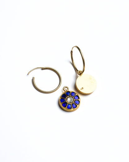 Close-up of small gold-polished 925 silver hoop earrings with deep blue lapis-style petal inlay and kundan stone centre.