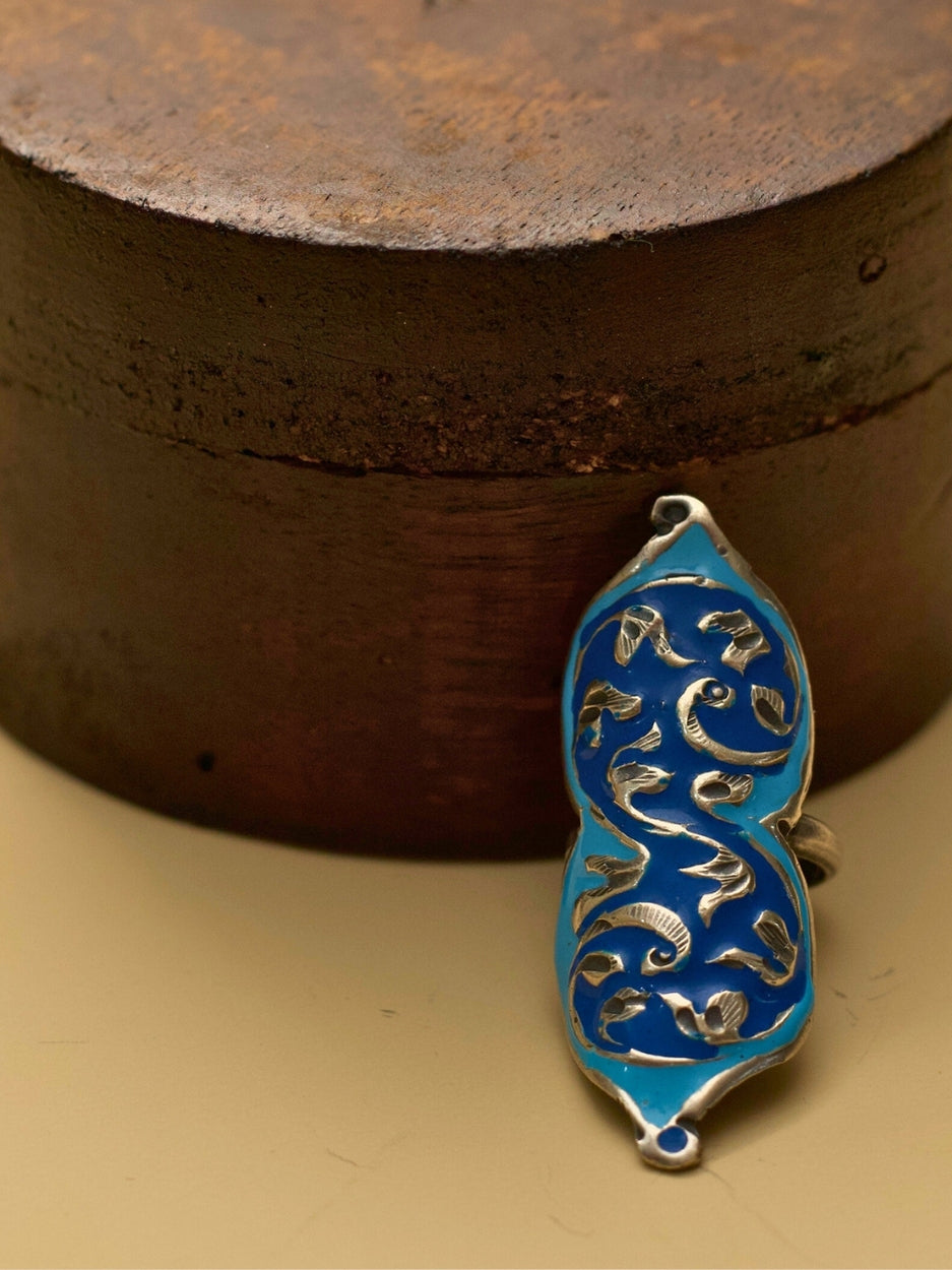 Neel Leher Enamel Ring by Naksa—elongated 925 silver ring with flowing vine motifs over deep blue enamel base.