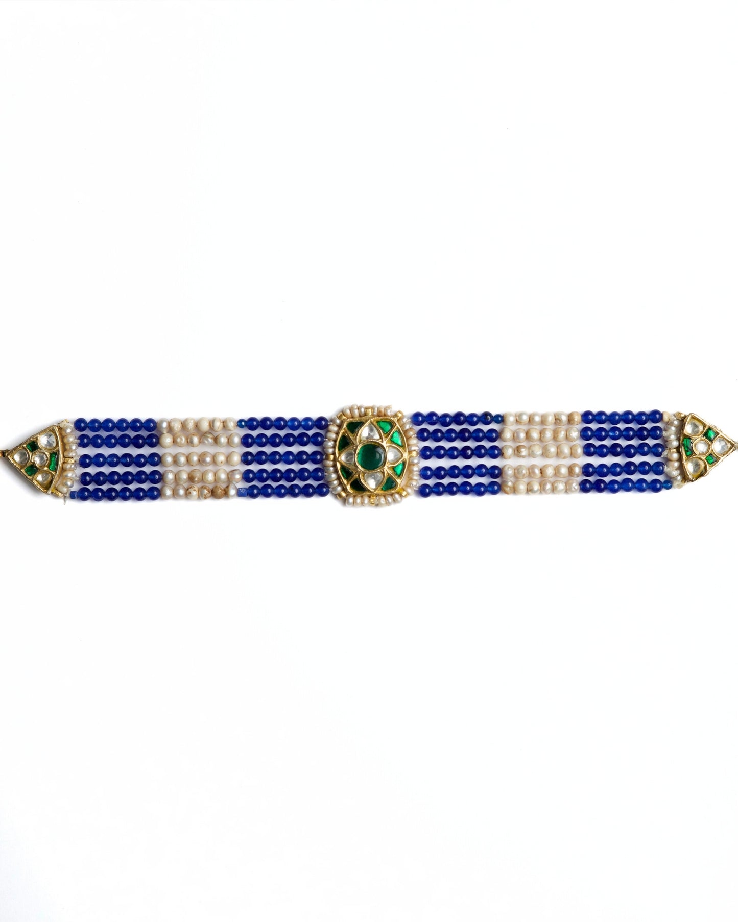 Blue and pearl striped choker in 925 silver with gold polish and kundan-set green centre stone by Naksa