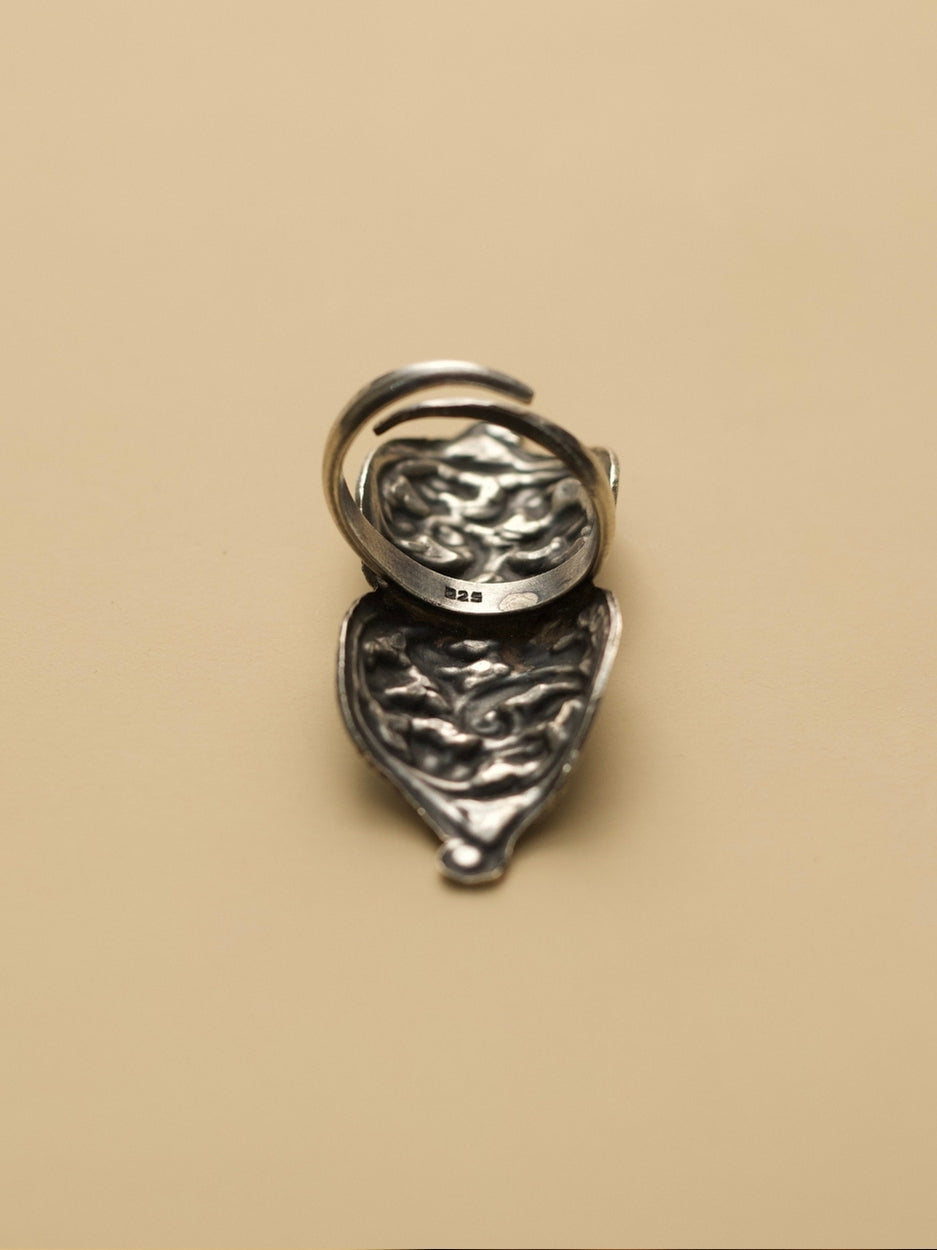 Neel Leher Enamel Ring by Naksa—elongated 925 silver ring with flowing vine motifs over deep blue enamel base.