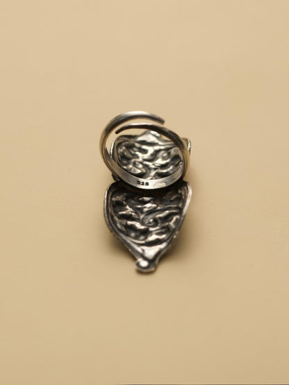 Neel Leher Enamel Ring by Naksa—elongated 925 silver ring with flowing vine motifs over deep blue enamel base.