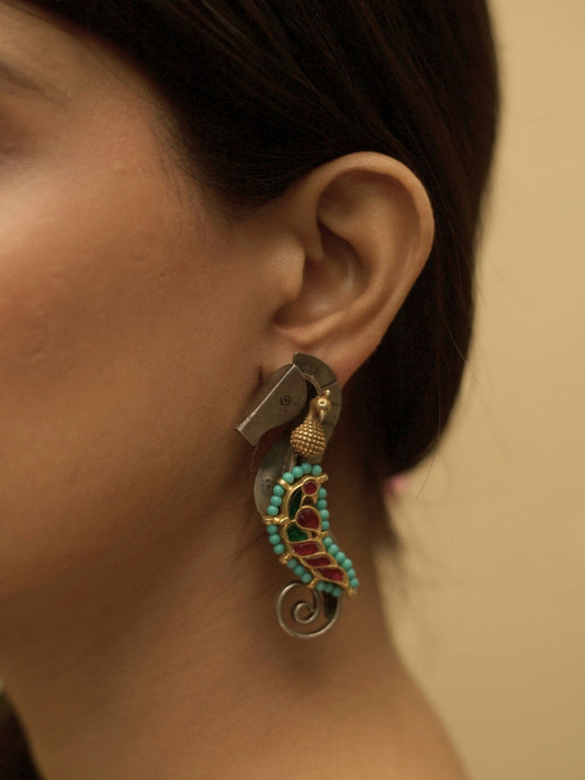 The Adorned Sea Horse Earrings by Naksa—oxidized 925 silver with bead detailing in pink, green, and turquoise.