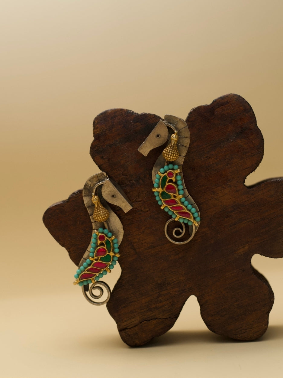 The Adorned Sea Horse Earrings by Naksa—oxidized 925 silver with bead detailing in pink, green, and turquoise.