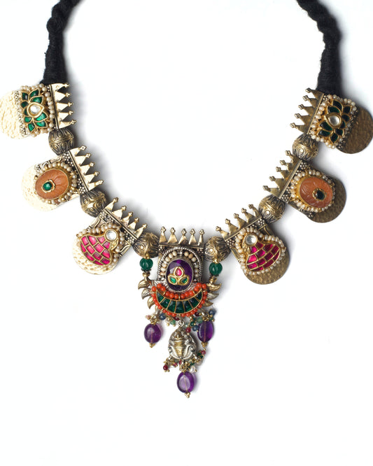 Crowned Motif Necklace featuring crown-shaped silver elements, enamel panels, kundan detailing, and a layered central drop