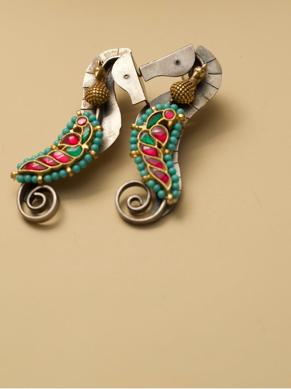 The Adorned Sea Horse Earrings by Naksa—oxidized 925 silver with bead detailing in pink, green, and turquoise.