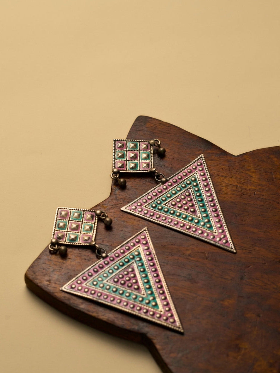 Nomad Angles Danglers by Naksa—oxidized 925 silver earrings with pastel pink and sea green enamel in geometric triangle and square motifs.