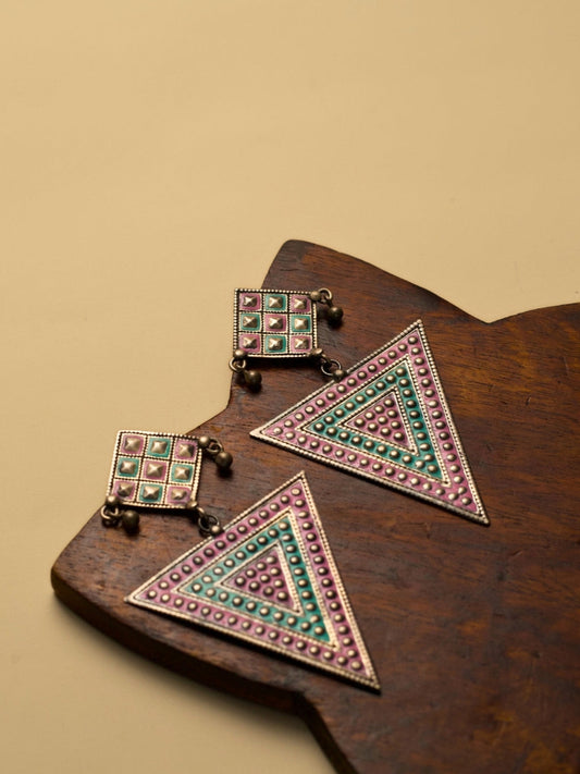 Nomad Angles Danglers by Naksa—oxidized 925 silver earrings with pastel pink and sea green enamel in geometric triangle and square motifs.