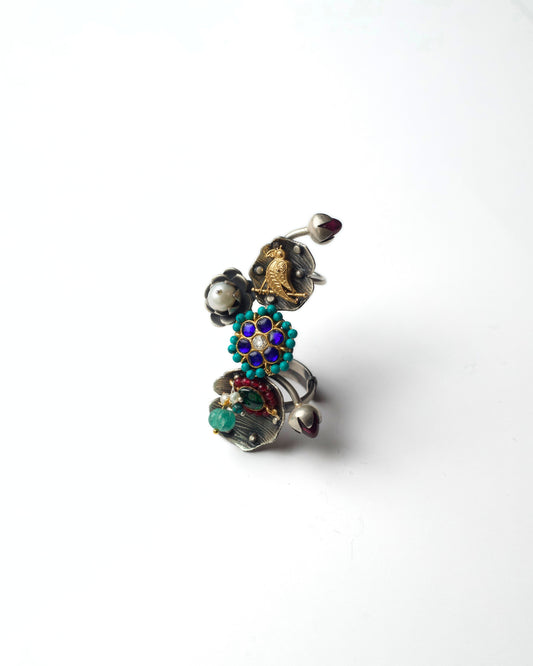 Gardenia Ascend full finger ring in 925 silver with layered gardenia motifs, perched bird detail, and sculptural vertical design