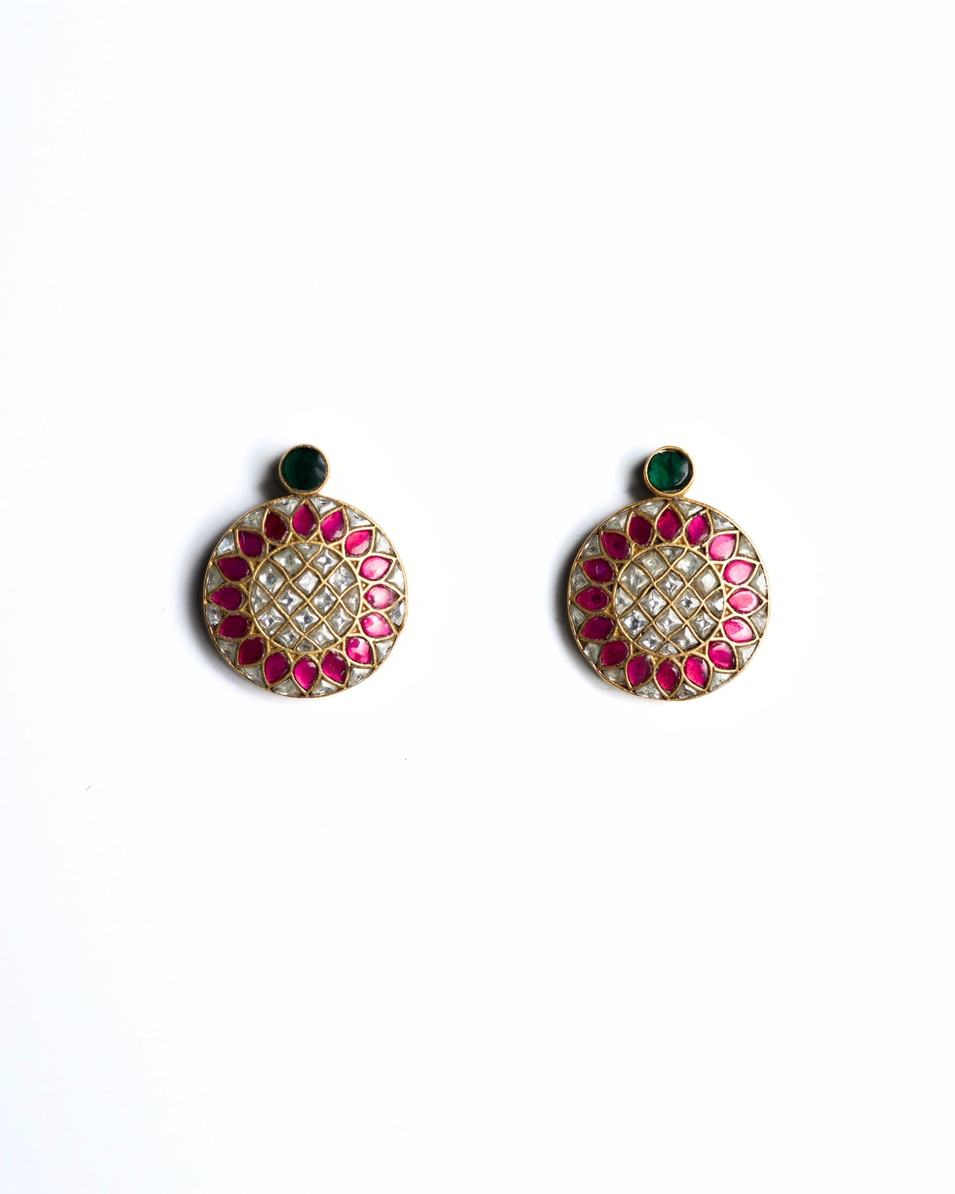Round pink and white kundan stud earrings in gold polished 925 silver with green top stone accent.