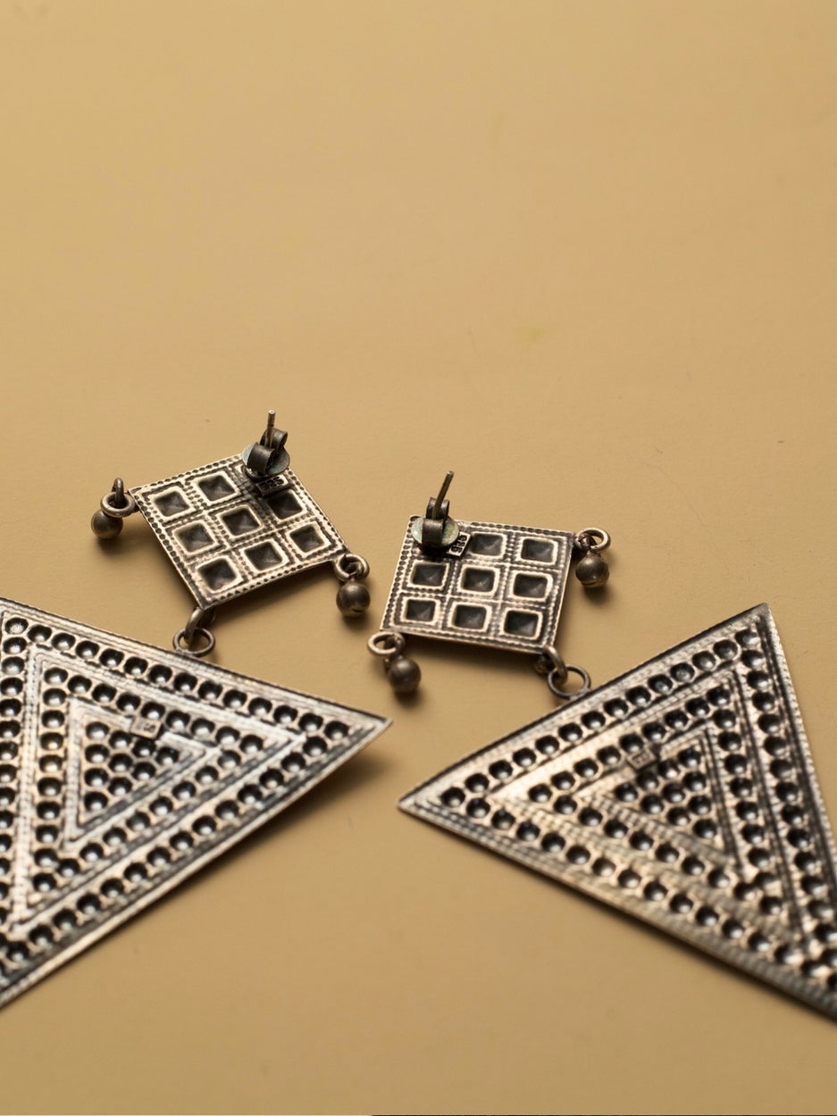 Nomad Angles Danglers by Naksa—oxidized 925 silver earrings with pastel pink and sea green enamel in geometric triangle and square motifs.
