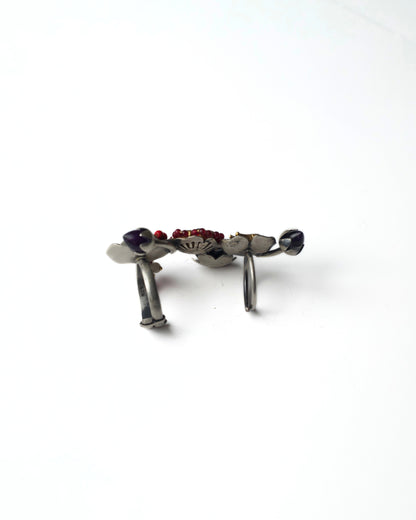 Side view of Ruby Gardenia Ascend Full Finger Ring in 925 silver, showing the sculptural curved bands, raised floral cluster, bird motif placement, and multi-layered full-finger structure.