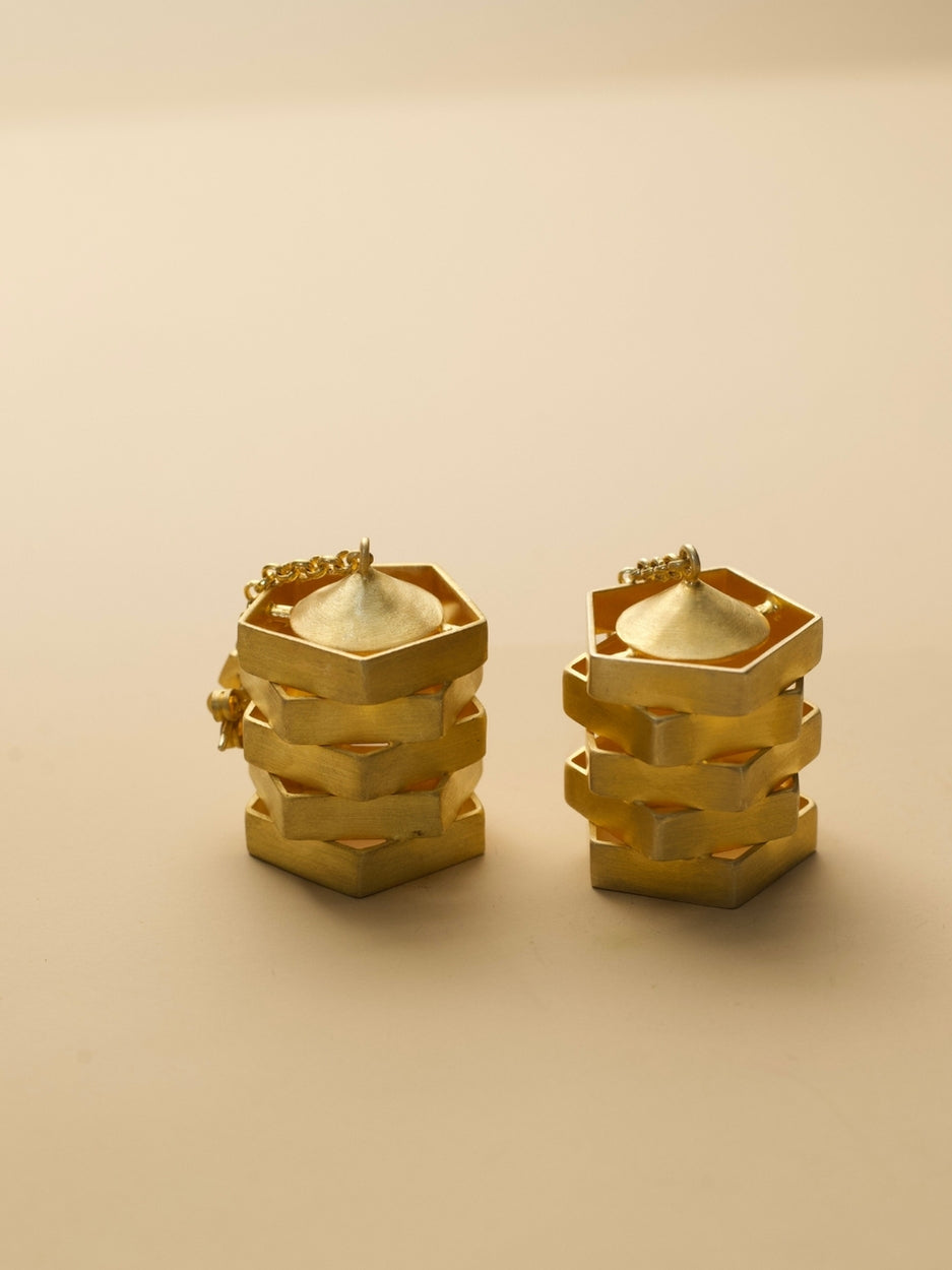 The Golden Hour Earrings by Naksa—matte gold polished sculptural 925 silver earrings with stacked geometric silhouette.