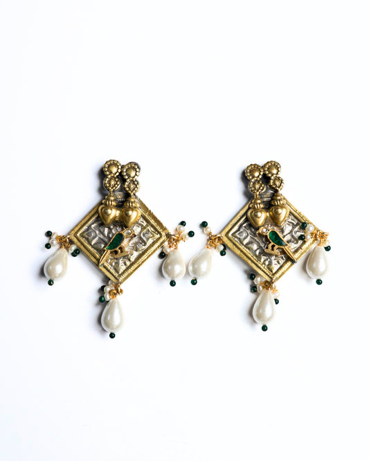 Gold polished 925 silver square earrings with twin heart detailing, green bird motif, and white pearl drop danglers.