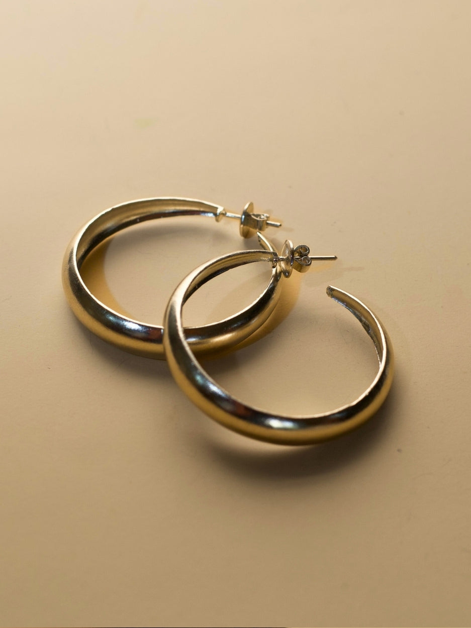 Hoops for Good earrings by Naksa—pure 925 silver classic hoop earrings with smooth finish.