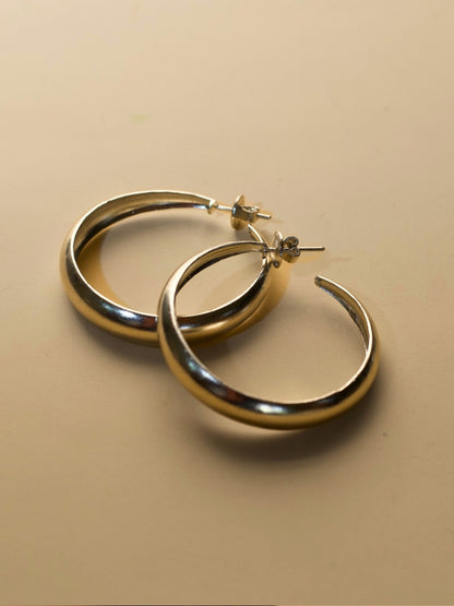 Hoops for Good earrings by Naksa—pure 925 silver classic hoop earrings with smooth finish.