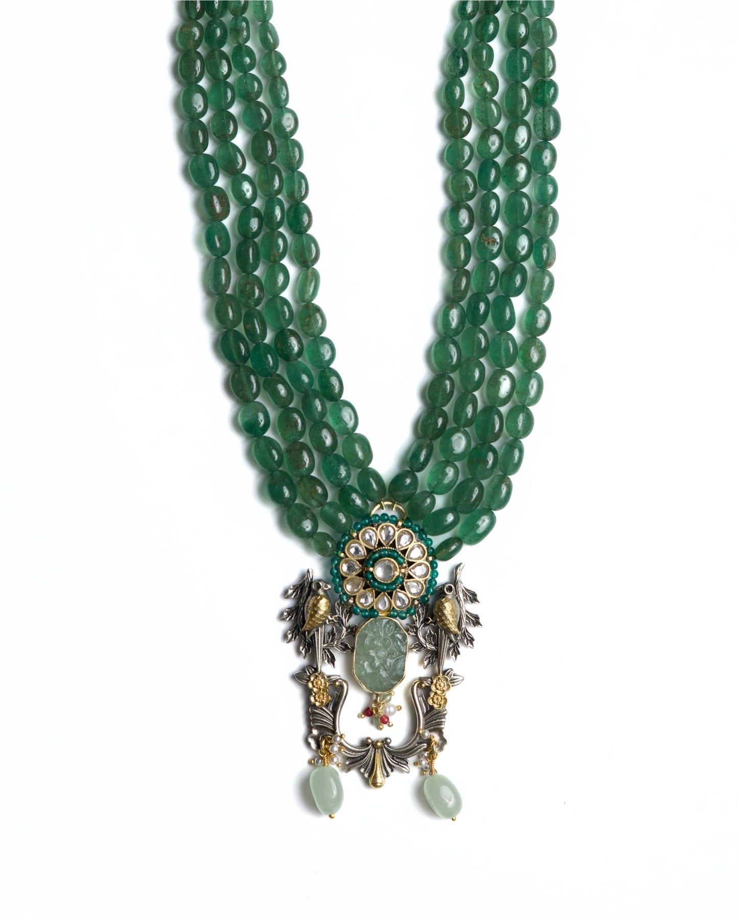 Four-strand green jade bead necklace in 925 silver with gold-plated kundan floral centre, twin bird motifs, carved jade drop, and decorative hanging elements.
