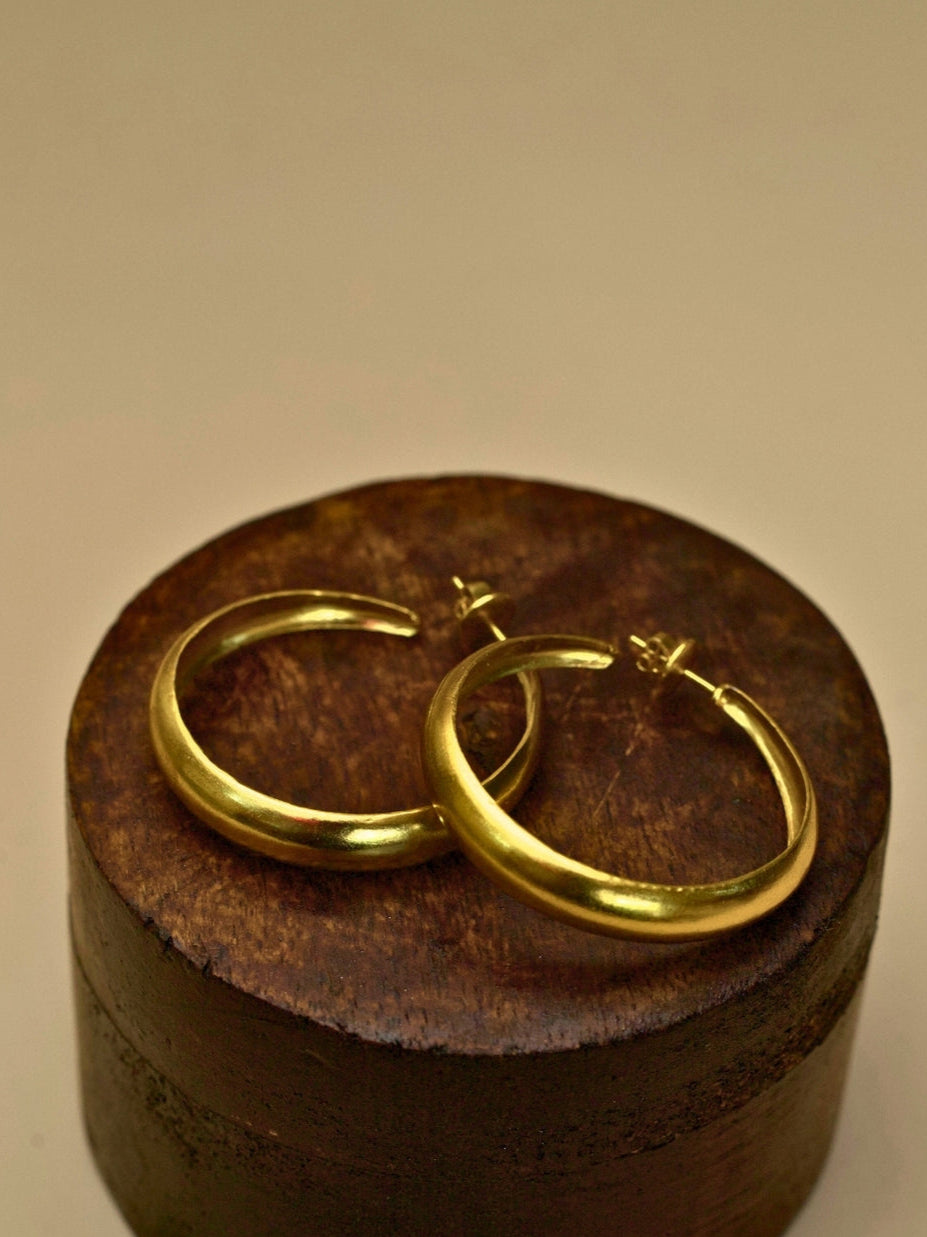 Hoops for Good earrings by Naksa—pure 925 silver gold classic hoop earrings with smooth finish.