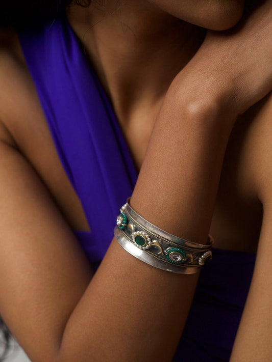 Handcrafted 92.5 silver bracelet with green enamel and tribal detailing, styled on wrist – Naksa Jewelry