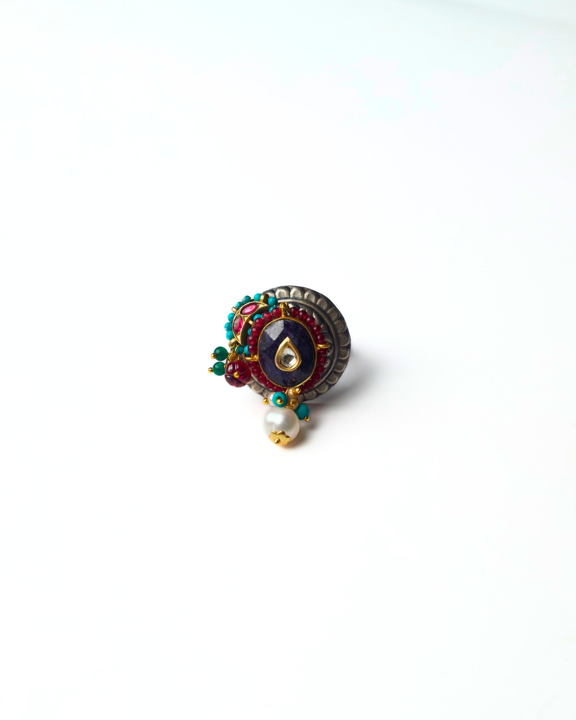 Indigo Core Ring in pure 925 silver featuring a deep indigo centre stone, circular layered setting, and pearl-accented detailing.