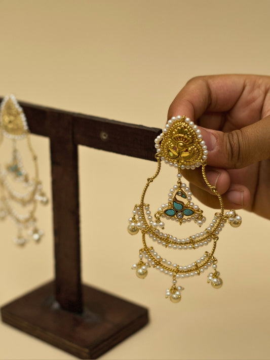 Tyohaar Jhumkas by Naksa—925 silver earrings with gold polish, layered pearl chains, kundan floral drops, and festive bell charms.
