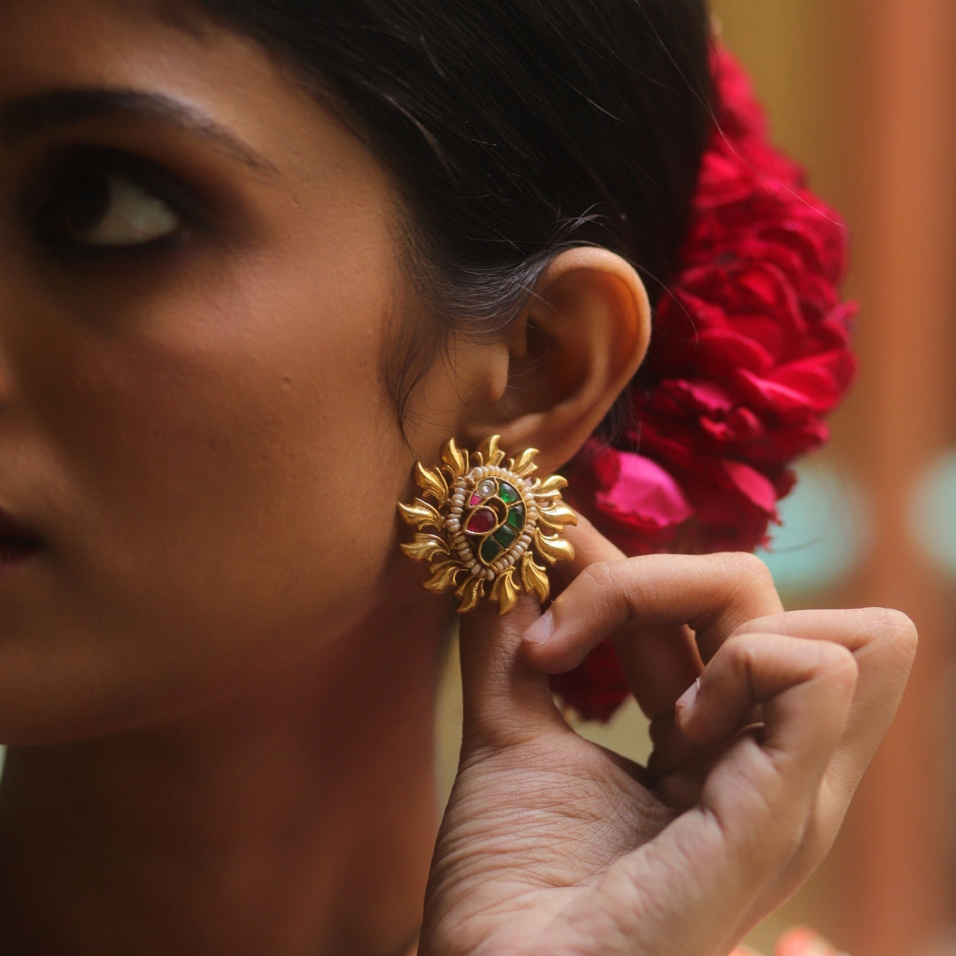 Gold-polished 925 silver teardrop-shaped studs featuring peacock and sun motifs, set with vibrant stones for a glamorous wedding look.